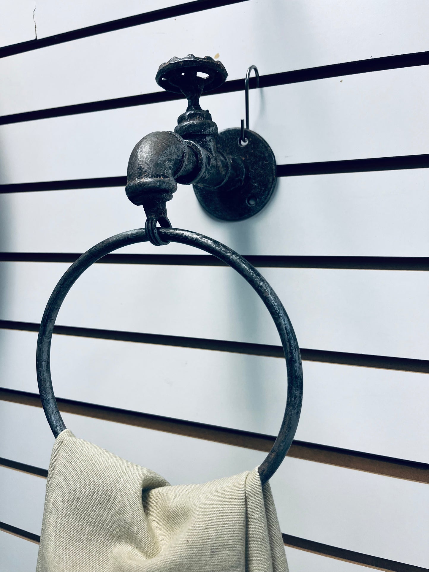 Water spigot towel ring
