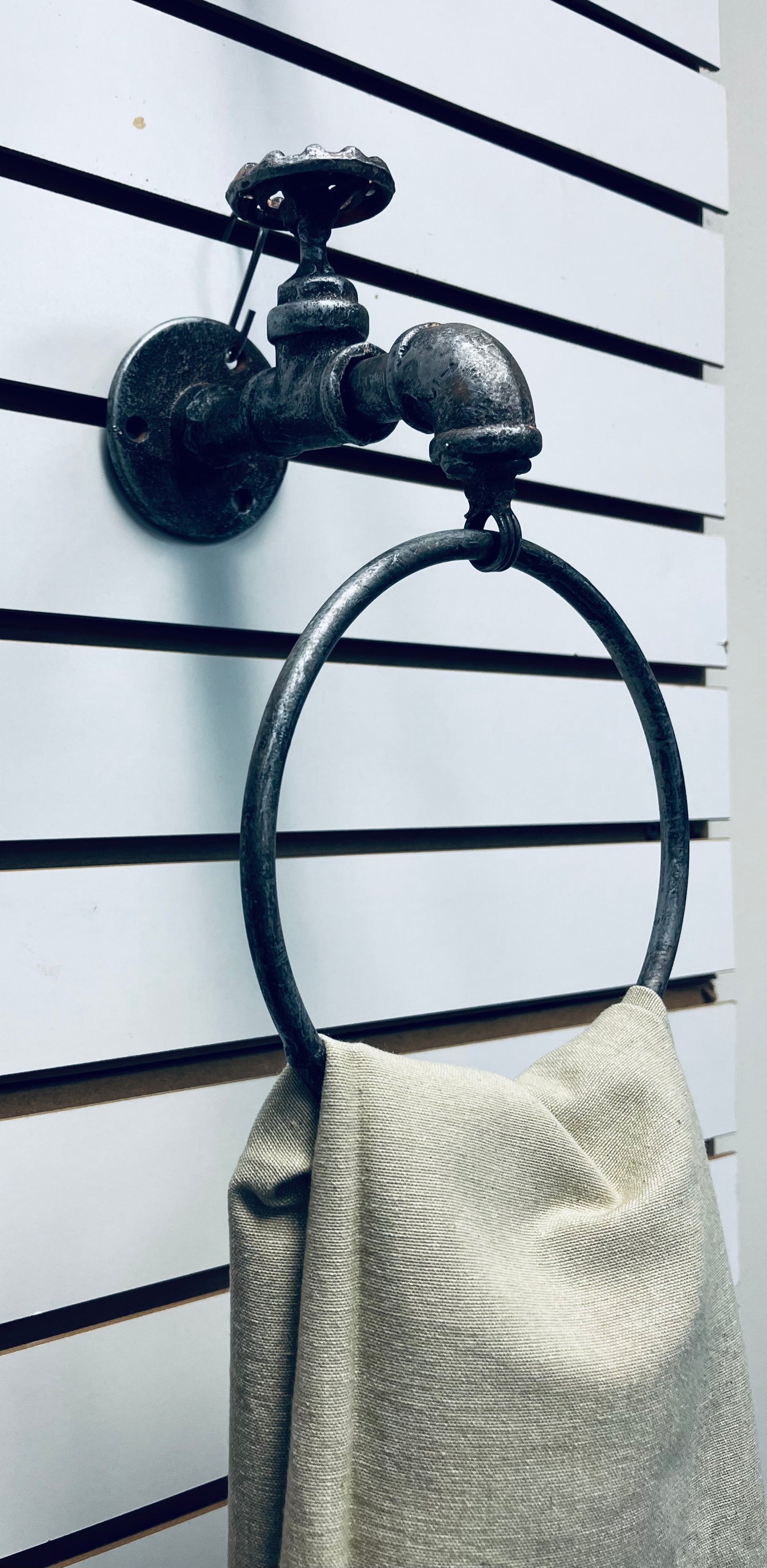 Water spigot towel ring